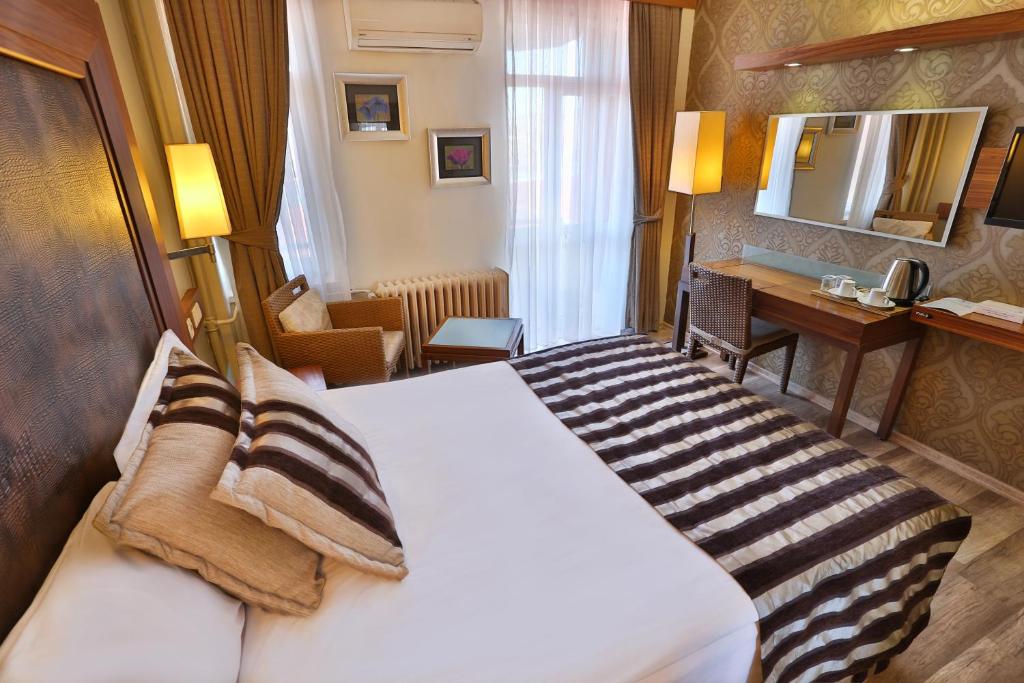 Postel nebo postele na pokoji v ubytování Grand Terme Hotel