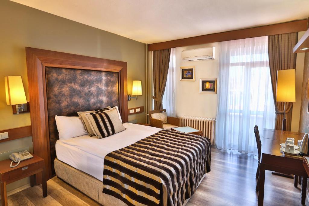 Postel nebo postele na pokoji v ubytování Grand Terme Hotel