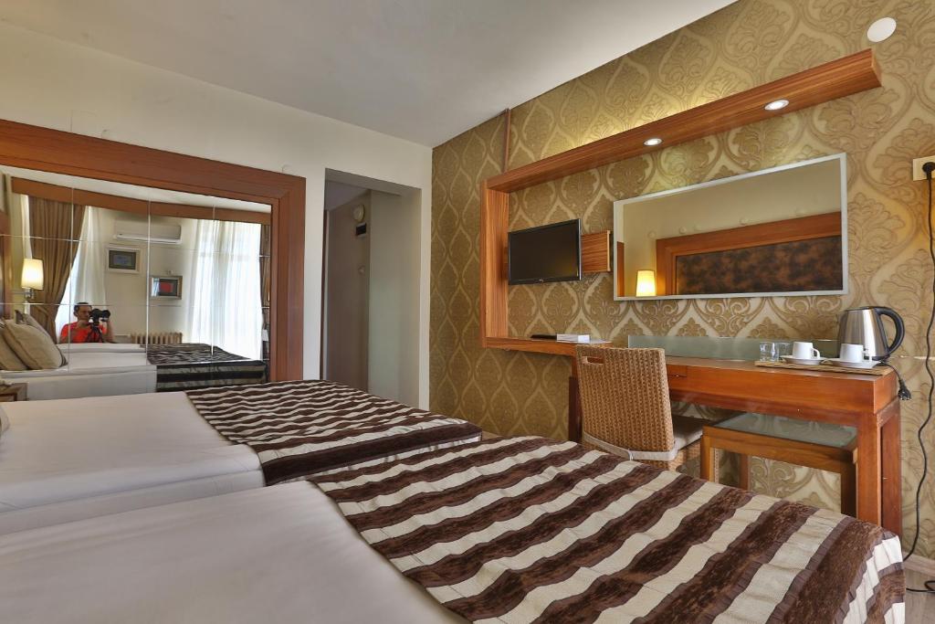 Postel nebo postele na pokoji v ubytování Grand Terme Hotel