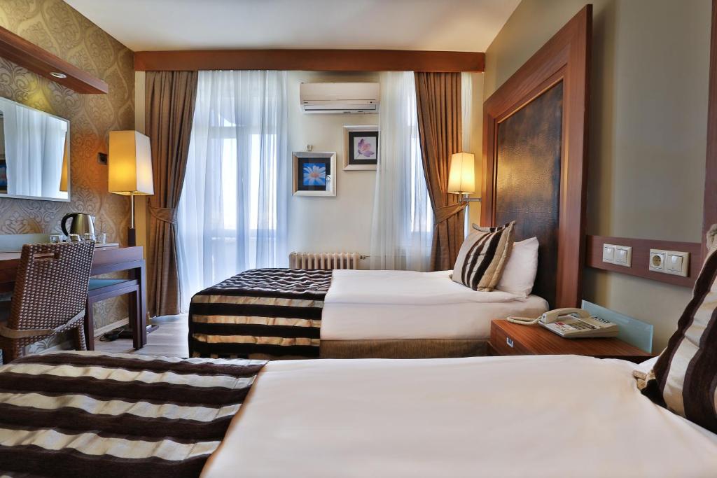 Postel nebo postele na pokoji v ubytování Grand Terme Hotel