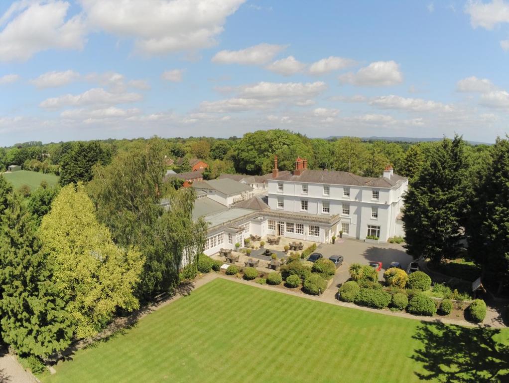 an aerial view of a mansion with a large yard at Rowton Hall Hotel and Spa in Chester