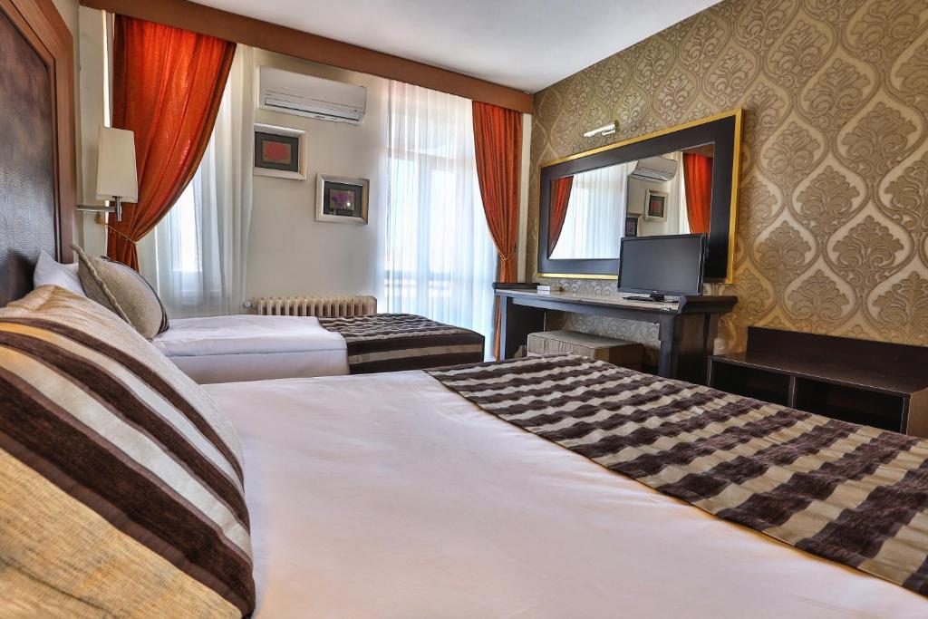 Postel nebo postele na pokoji v ubytování Grand Terme Hotel