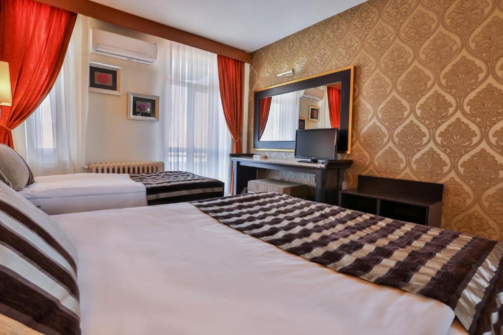 Postel nebo postele na pokoji v ubytování Grand Terme Hotel
