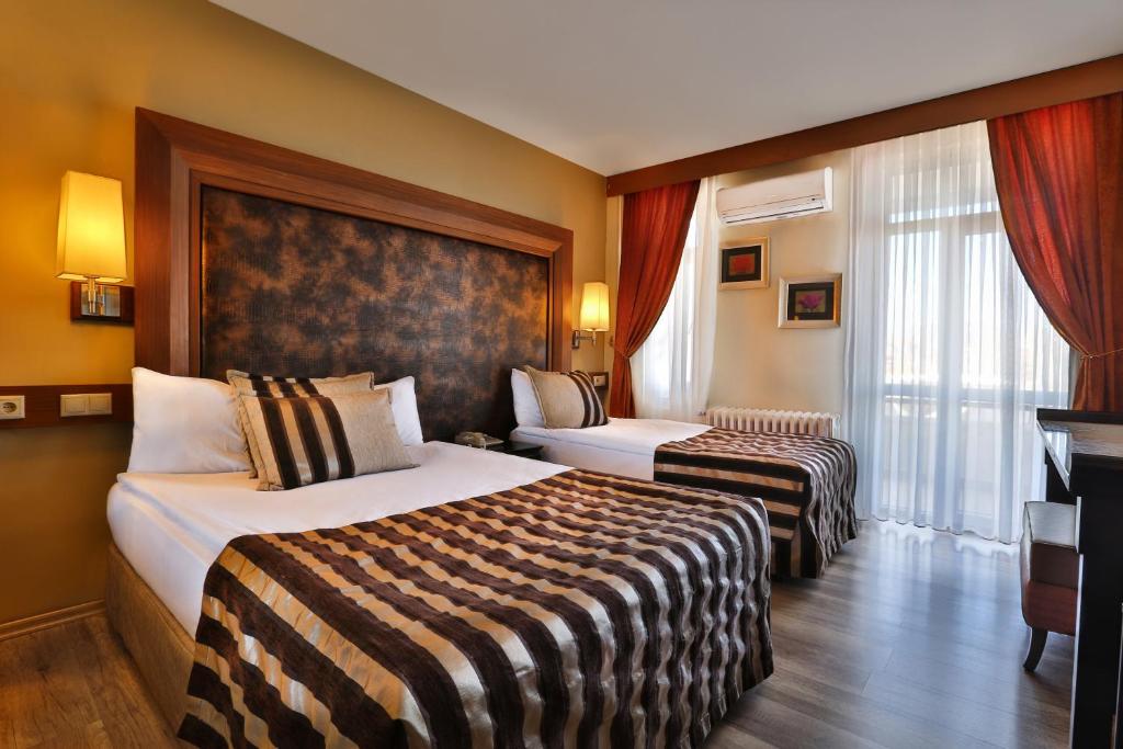 Postel nebo postele na pokoji v ubytování Grand Terme Hotel