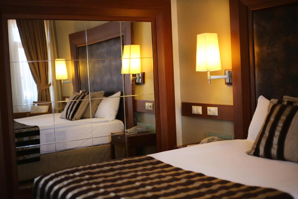 Postel nebo postele na pokoji v ubytování Grand Terme Hotel
