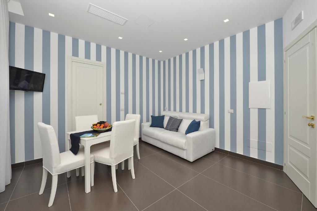 Łóżko lub łóżka w pokoju w obiekcie Costa d'Amalfi Apartments