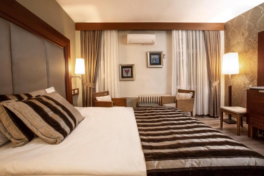 Postel nebo postele na pokoji v ubytování Grand Terme Hotel