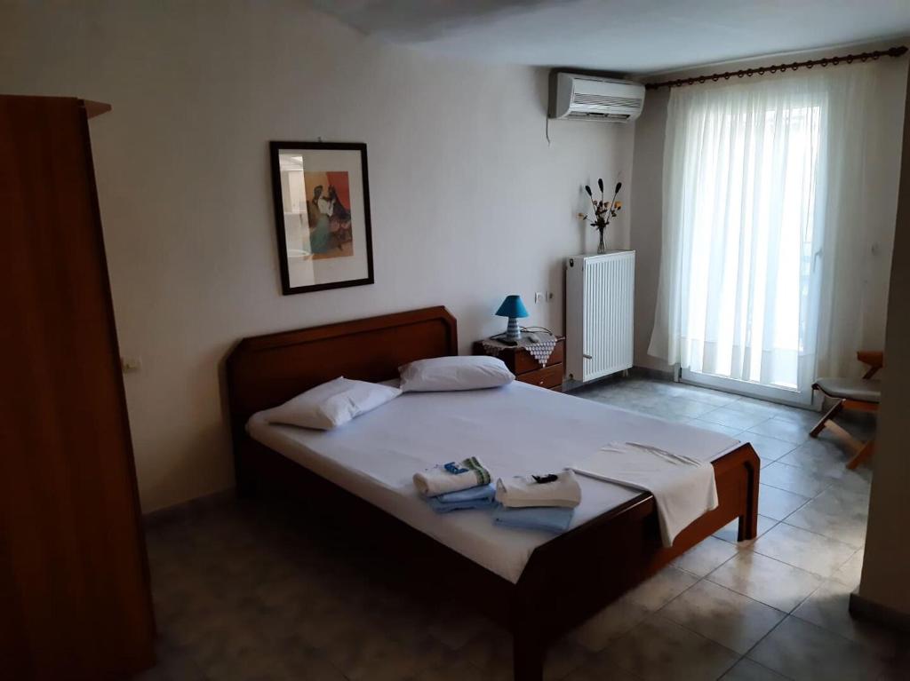 Postel nebo postele na pokoji v ubytování Aktaion Hotel