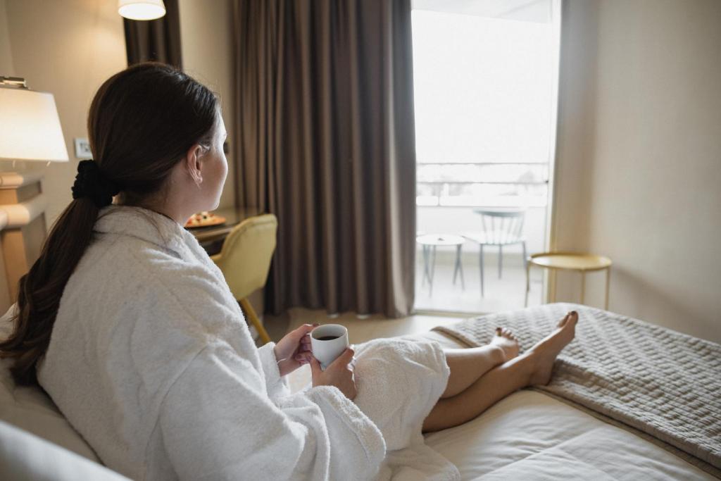 Postel nebo postele na pokoji v ubytování Emmantina Hotel