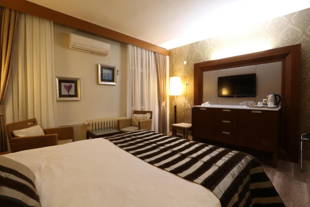 Postel nebo postele na pokoji v ubytování Grand Terme Hotel
