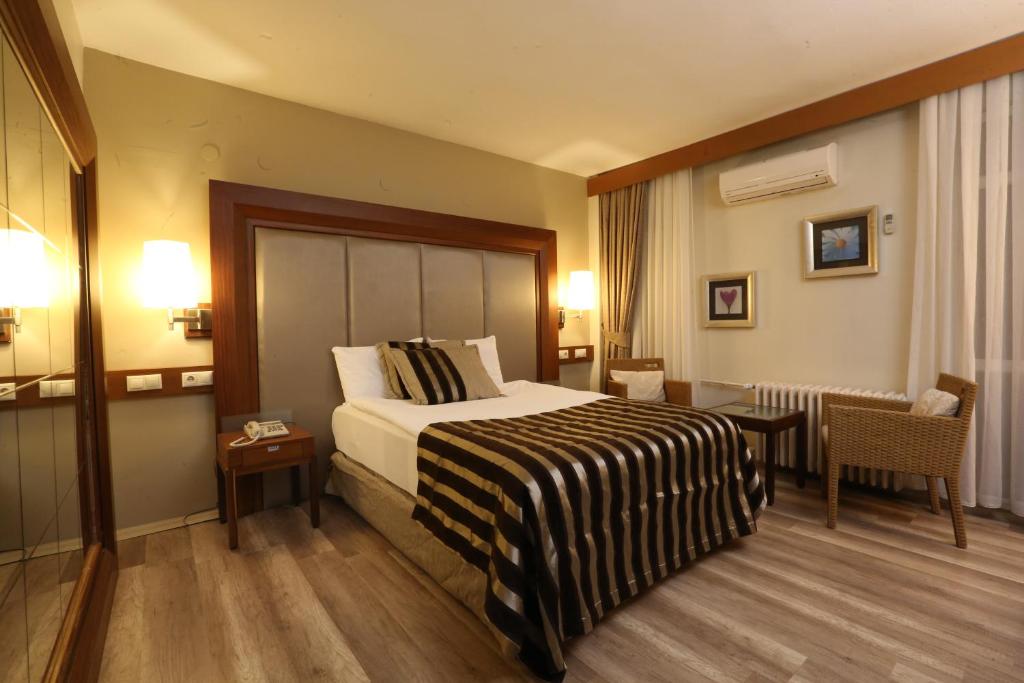 Postel nebo postele na pokoji v ubytování Grand Terme Hotel
