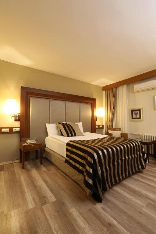 Postel nebo postele na pokoji v ubytování Grand Terme Hotel