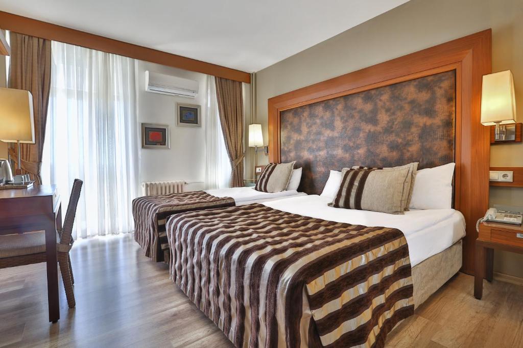 Postel nebo postele na pokoji v ubytování Grand Terme Hotel