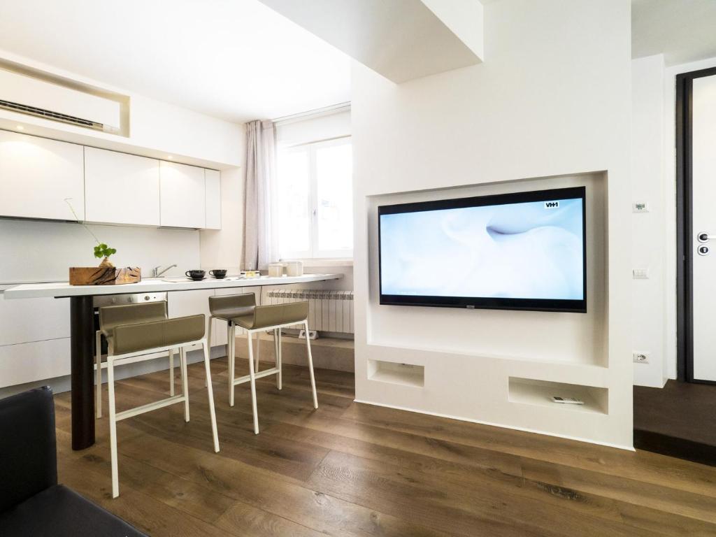 Televízia a/alebo spoločenská miestnosť v ubytovaní Gallery House