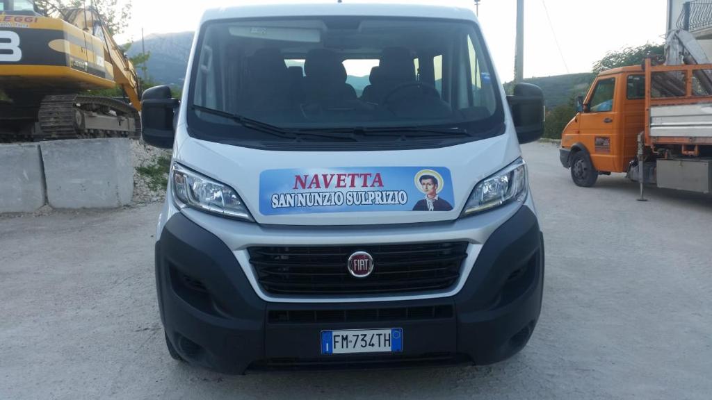 a white van is parked in a parking lot at Appartamento Vacanza in Torre deʼ Passeri