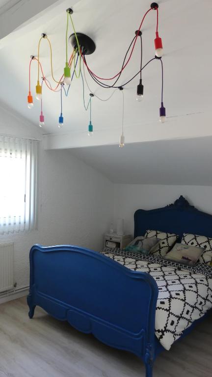 Postel nebo postele na pokoji v ubytování Bleuvelours