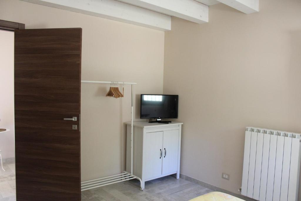 TV a/nebo společenská místnost v ubytování Archi Rooms
