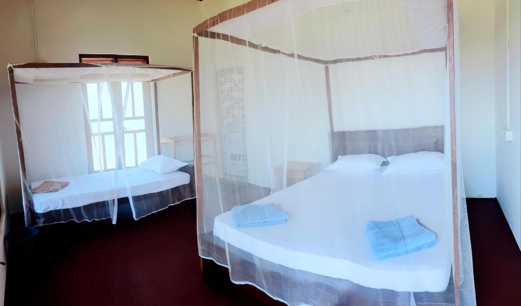 Postel nebo postele na pokoji v ubytování Exotic Beach Hotel