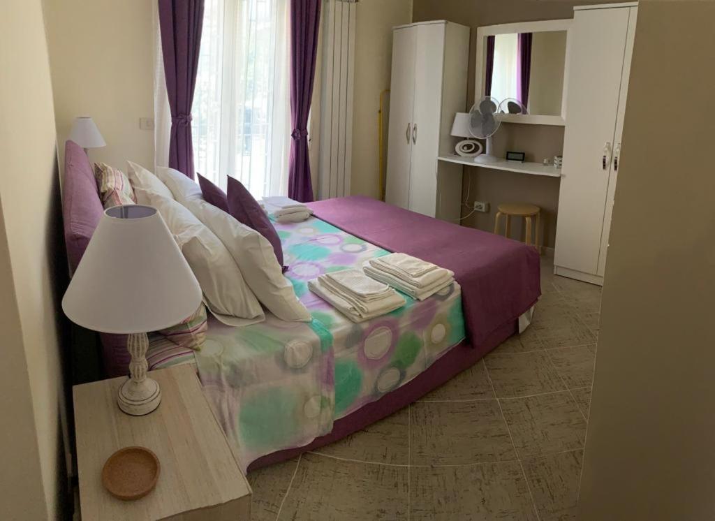 Postel nebo postele na pokoji v ubytování La Casetta di Guendalina