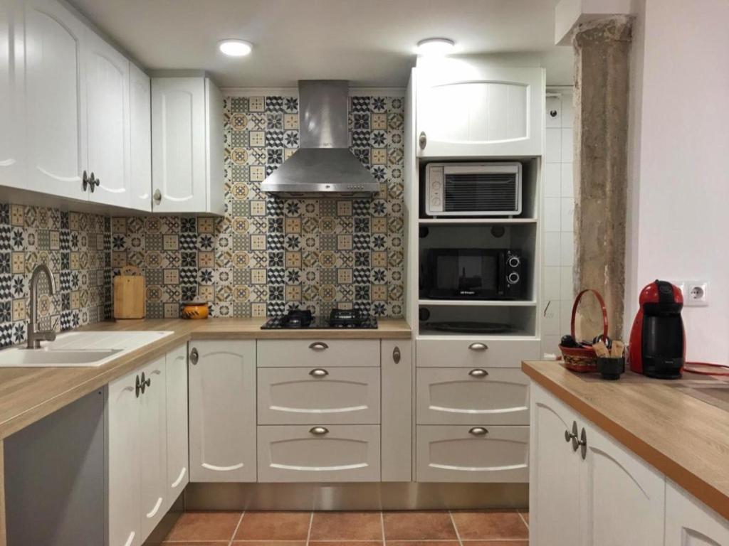 Una cocina o zona de cocina en Cal Pere de L'Onclet