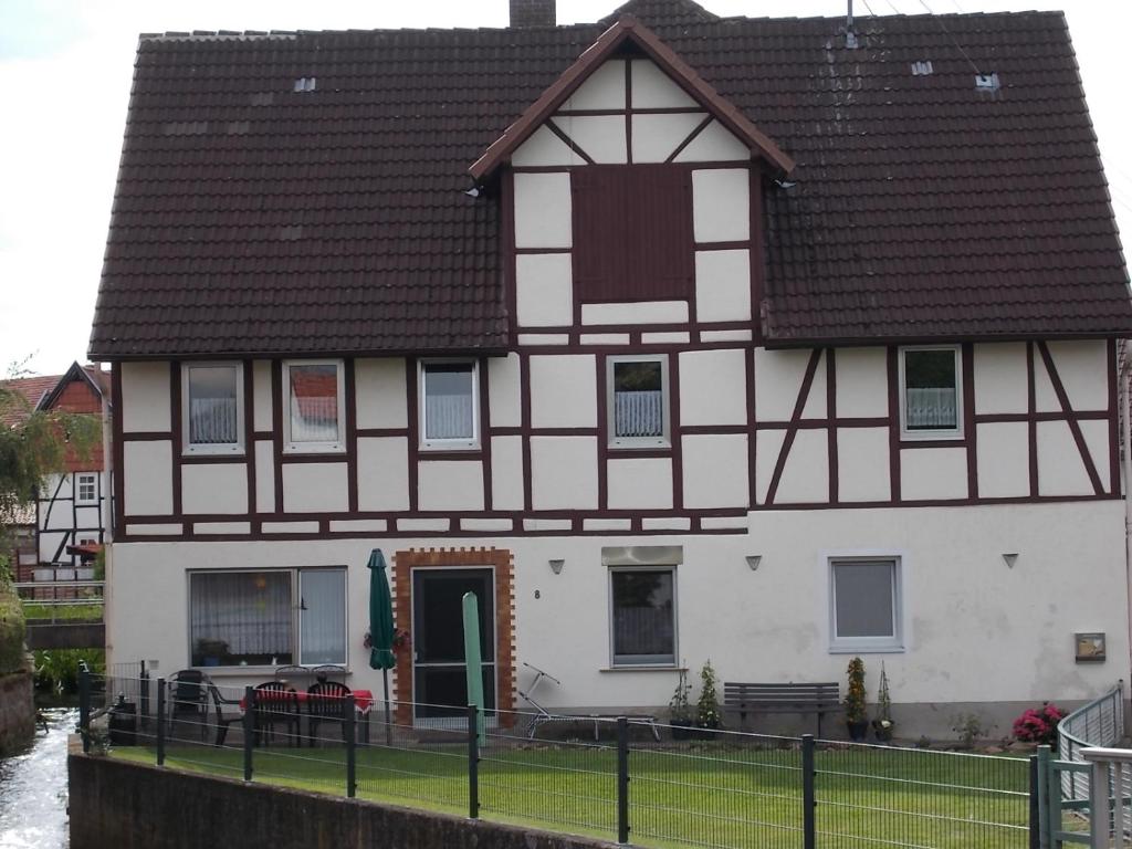 a large white house with a brown roof at Ferienhaus Klinder in Bad Arolsen