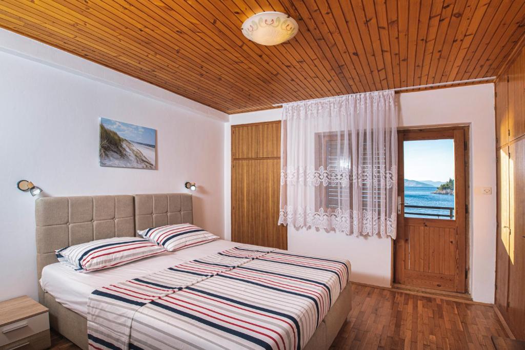 Postel nebo postele na pokoji v ubytování Apartments Stokic