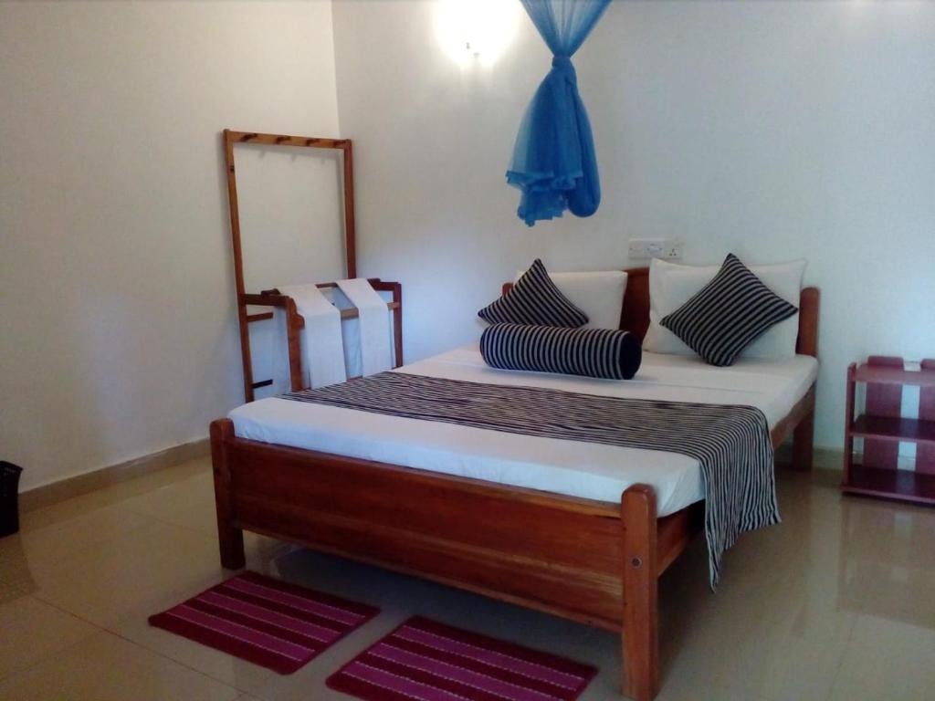Postel nebo postele na pokoji v ubytování Hotel Samanala Sigiriya