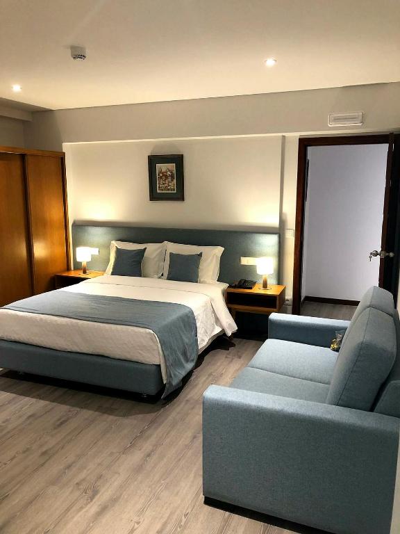 Postel nebo postele na pokoji v ubytování Vera Cruz Porto Downtown Hotel