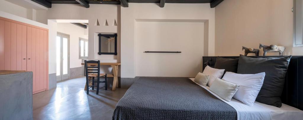 מיטה או מיטות בחדר ב-Misteli Suites