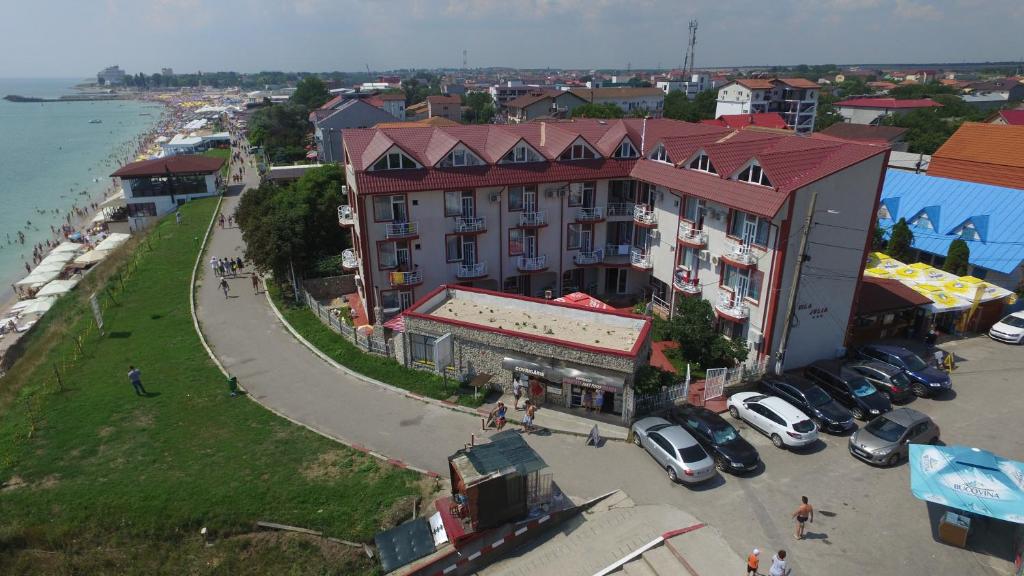 an aerial view of a building next to the ocean at Vila Julia Costinesti in Costinesti