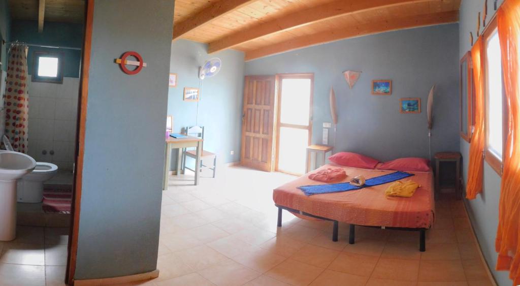 Postel nebo postele na pokoji v ubytování Tortuga B&B