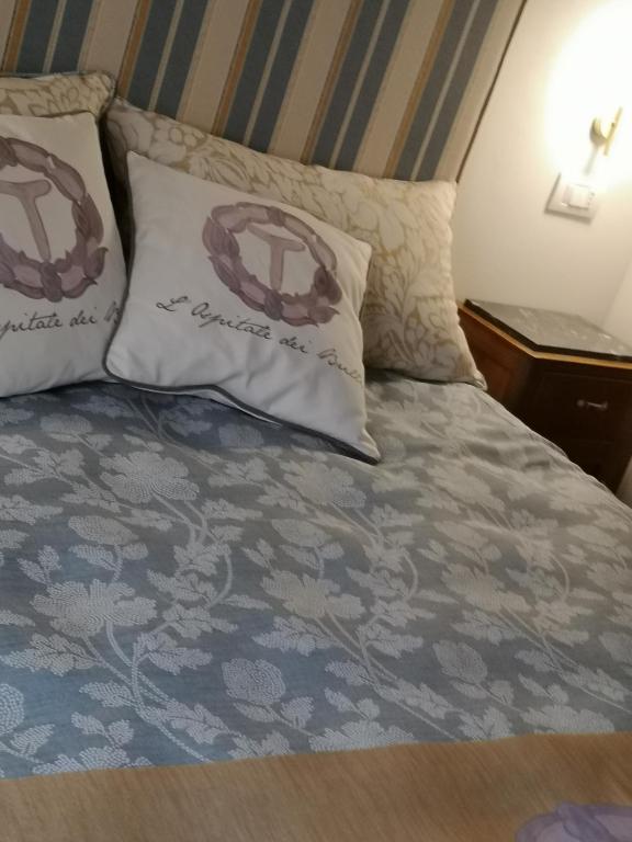 Postel nebo postele na pokoji v ubytování L'Ospitale dei Brilli