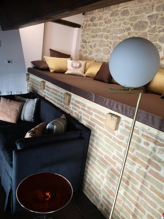 Postel nebo postele na pokoji v ubytování L'Ospitale dei Brilli