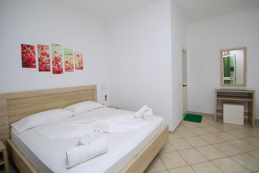 Postel nebo postele na pokoji v ubytování Hotel Jon
