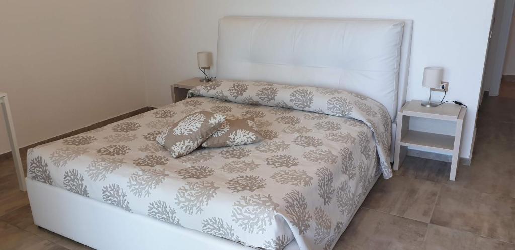 Postel nebo postele na pokoji v ubytování Hotel La Contessa