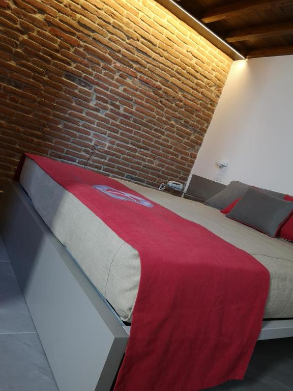 Postel nebo postele na pokoji v ubytování L'Ospitale dei Brilli