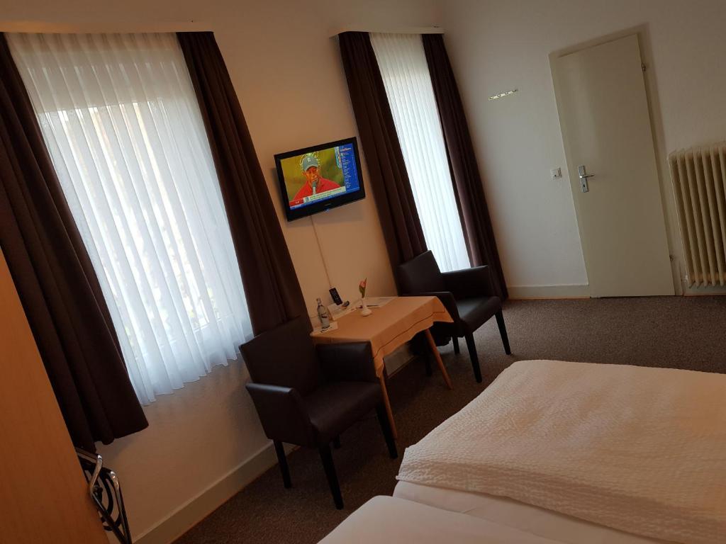 Postel nebo postele na pokoji v ubytování Hotel zum Anker