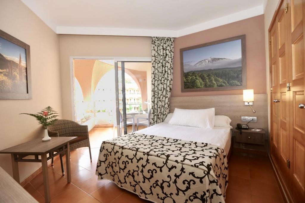 Postel nebo postele na pokoji v ubytování Hotel Puerto Palace