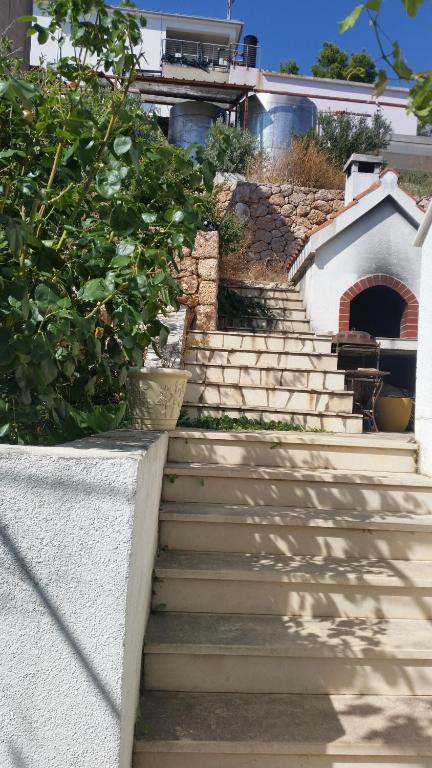 a set of stairs in front of a house at Apartments Vila Vino in Sveta Nedelja