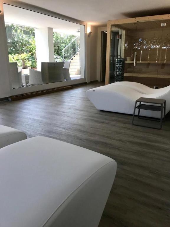 Postel nebo postele na pokoji v ubytování Hotel Tritone