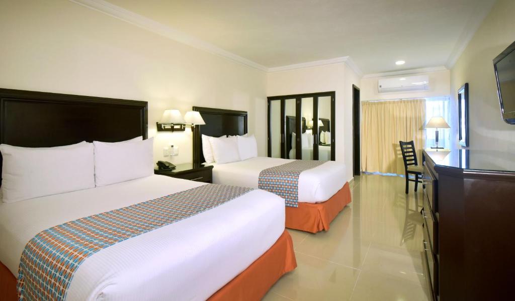Postel nebo postele na pokoji v ubytování Hotel Bonampak