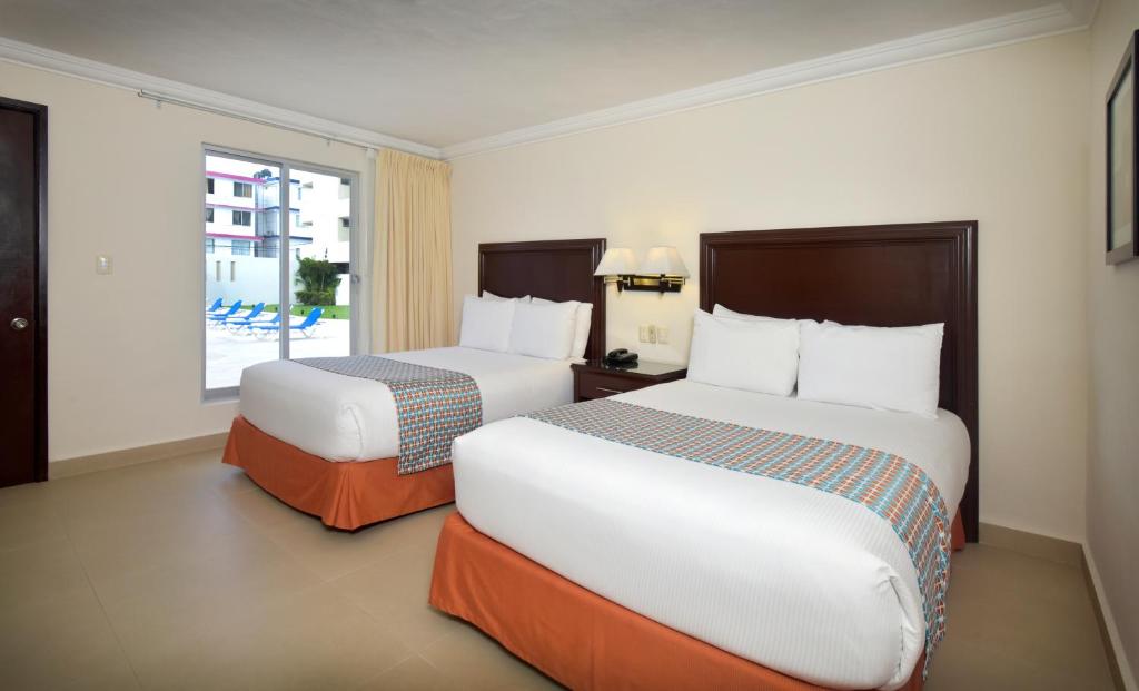 Postel nebo postele na pokoji v ubytování Hotel Bonampak