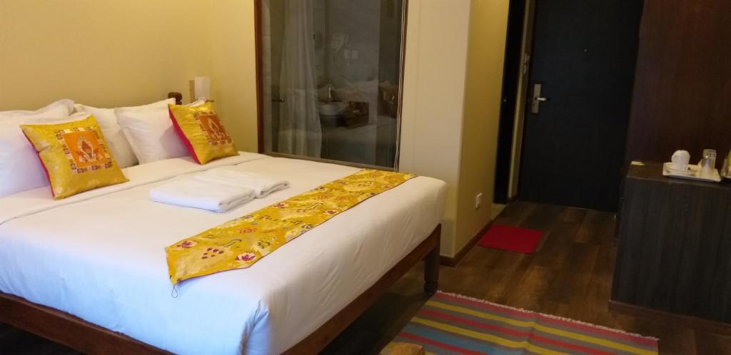 Postel nebo postele na pokoji v ubytování Hotel Mala Pokhara