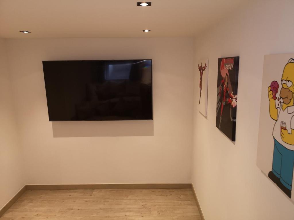 TV a/nebo společenská místnost v ubytování Chalet Fuchsbau