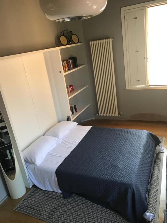 Posteľ alebo postele v izbe v ubytovaní MG 49 Appartamento
