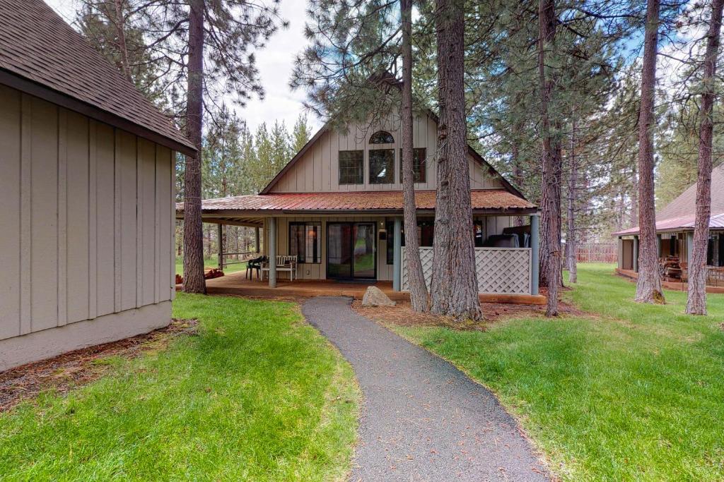 a house with a path in front of it at 27 Circle Four Cabin in Sunriver