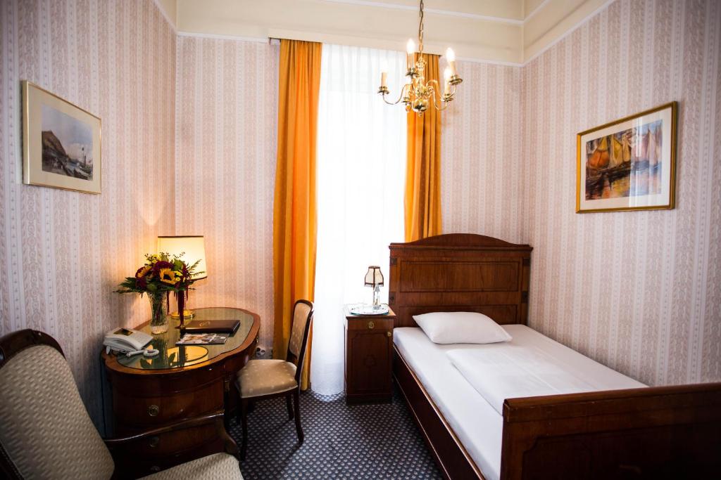 Postel nebo postele na pokoji v ubytování Hotel Atlanta