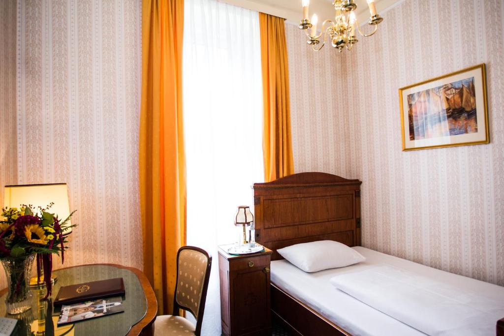 Postel nebo postele na pokoji v ubytování Hotel Atlanta
