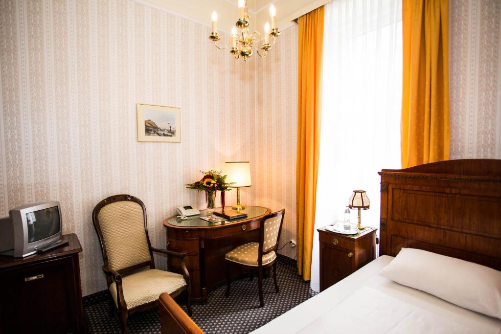Postel nebo postele na pokoji v ubytování Hotel Atlanta