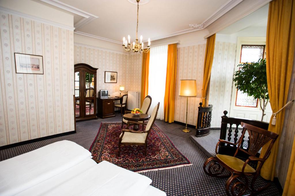 Postel nebo postele na pokoji v ubytování Hotel Atlanta